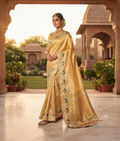 Golden tissue organza saree with green parrot printed motifs and zardozi buti work