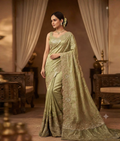 Light pista green saree with gota patti work, light zardozi detailing and a scalloped border