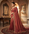 Rani pink tissue georgette saree with zardozi work, a floral border and scattered motifs