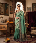 Firozi green soft silk saree with katdana and zardozi work and a scalloped cutwork border