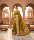 Mehndi green handloom silk saree with scattered buti and a broad golden-toned woven border
