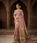 Pink tissue silk saree with floral thread work and a broad golden-toned border