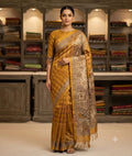 Yellow saree with a patterned border and contrasting printed pallu with tassels