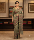Green linen saree with floral pattern and thread work